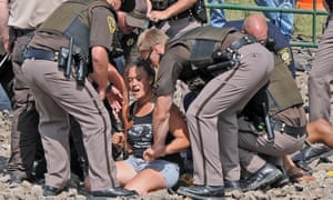 Tribune Law enforcement arrested several people protesting the Dakota Access pipeline on a newly constructed roadway to be used in building the pipeline Thursday, Aug. 11, 2016.