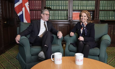 Keir Starmer and Natalie Elphicke sitting on armchairs. Elphicke is smiling while Starmer looks contemplative.