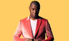 Journalist and presenter Clive Myrie, in white T-shirt and pink suit against yellow background