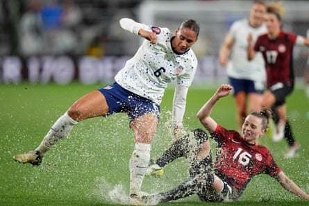 USA forward Lynn Williams battles for the ball against Canada midfielder Gabby Carle during the second half of Wednesday’s Concacaf W Gold Cup semi-final match at Snapdragon Stadium.