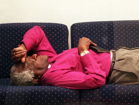 Desmond Tutu lying on a sofa