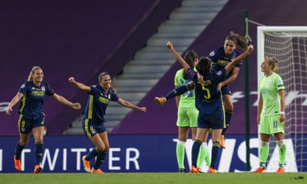 Saki Kumagai (No 5) celebrates her goal for Lyon.