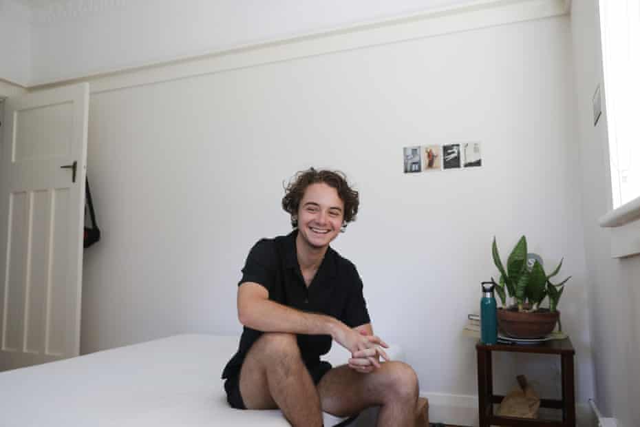 Remy Boyd sitting on a bed