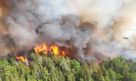 In this image released by the Ontario Ministry of Natural Resources and Forestry, the Sudbury 17 wildfire burns east of Mississagi Provincial Park near Elliot Lake, Ontario, on Sunday, June 4, 2023 handout photo.
