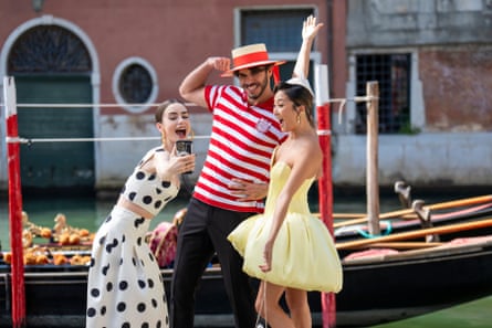 Emily and Mindy (Ashley Park) in Emily in Paris.