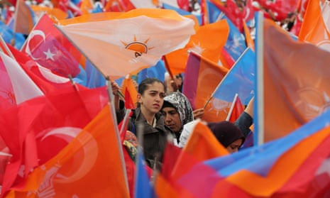 Supporters listen to Turkish prime minister Ahmet Davutoğlu at an AKP rally.