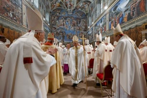 Pope Leo XIV, centre, amid other cardinals after Mass at the Sistine Chapel