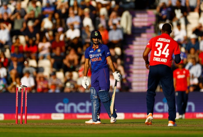 Indian Harshal Patel watches as English Jos Buttler (not pictured) tries to escape.