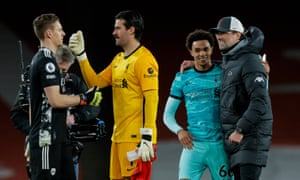 Jürgen Klopp congratulates Trent Alexander-Arnold, while the Arsenal goalkeeper Bernd Leno talks to Alisson, his Liverpool counterpart