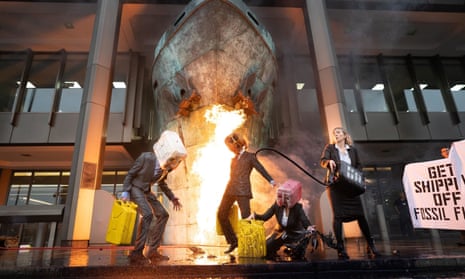 Ocean Rebellion activists holding a protest outside the International Maritime Organisation offices in central London today. They are opposed to the use of fossil fuel in the shipping industry.