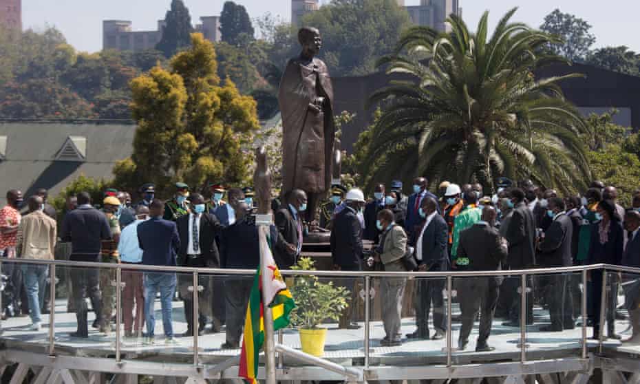  Officials gather around a statue of a spirit medium known as Mbuya Nehanda, after it was unveiled by President Emmerson Mnangagwa during the Africa Day celebrations in Harare, Zimbabwe.