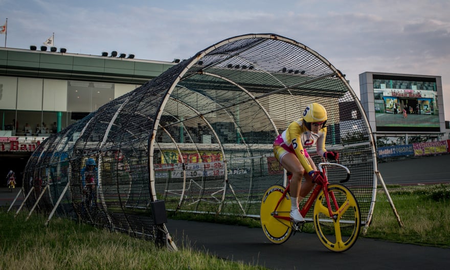 A rider enters the velodrome ahead of her race at the Kawasaki velodrome in 2015.
