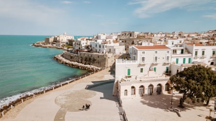 View of a white Italian town with sea to the left