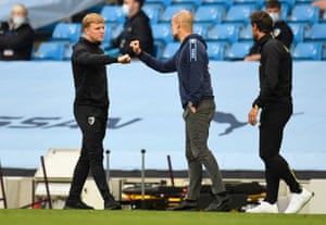 Pep Guardiola shakes hands with Eddie Howe after the match.