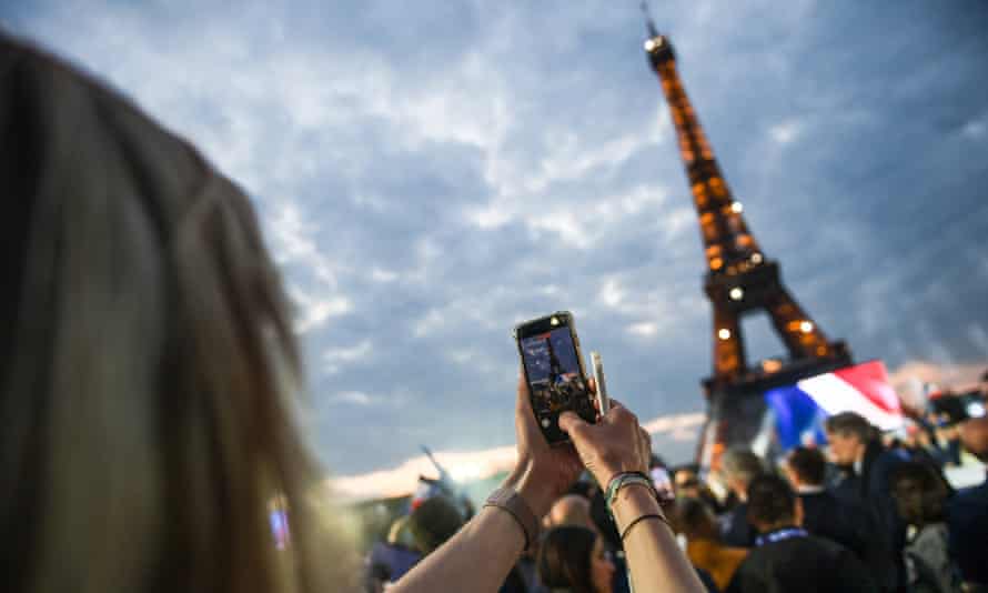 French people gather on the Champ-de-Mars in the 7th arrondissement of Paris to celebrate Macron’s victory