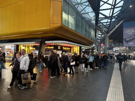 Peak hour commuters queueing at Southern Cross station in Melbourne after delays to V-Line services caused by the Telstra outage. 8 July 2026