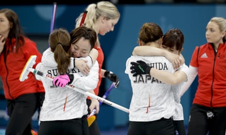 Japan team celebrates winning the women’s bronze medal curling match.