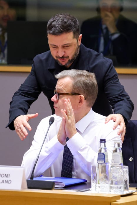 Zelenskyy greets a seated Orpo