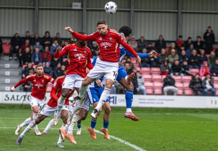 Fabio Borini wins a header for Salford against Oldham.