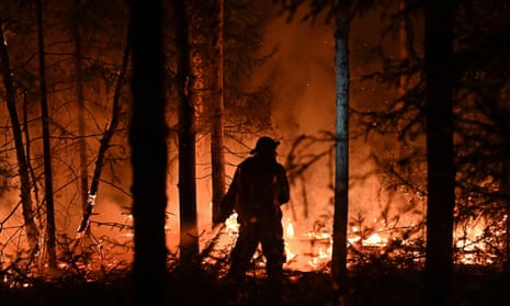 A volunteer works to extinguish a wildfire near the town of Revda in Russia last month.
