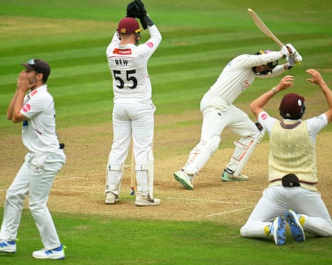 Lewis Gregory, James Rew and Craig Overton of Somerset react as the batter George Drissell of Durham looks on