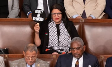 Rashida Tlaib held up protest sign during speech