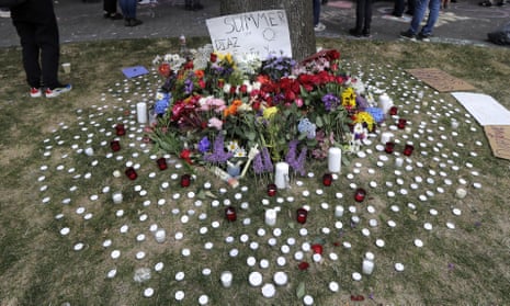 Candles and flowers form a tribute to Summer Taylor and Diaz Love during a rally near the King county courthouse, 22 July 2020, in Seattle.