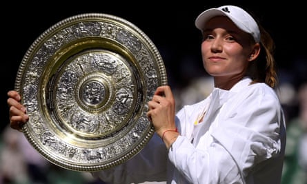 Elena Rybakina poses with the trophy after winning the Wimbledon women’s singles final against Ons Jabeur.