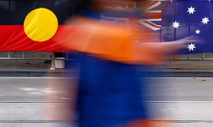 blurred photo of australian and aboriginal flags