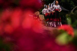 Girls wearing traditional outfits dance during an event inspired by pre-Christian traditions, in which fairies, called Sanziene in Romanian, come to earth for the summer solstice bringing fertility to land and beings, at the Dimitrie Gusti village museum