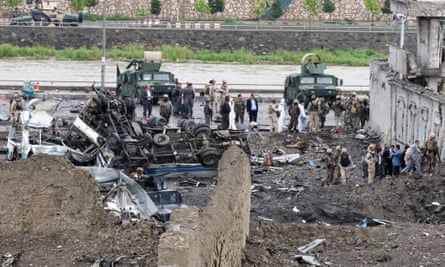 Afghan security officials at the site of the Kabul blast