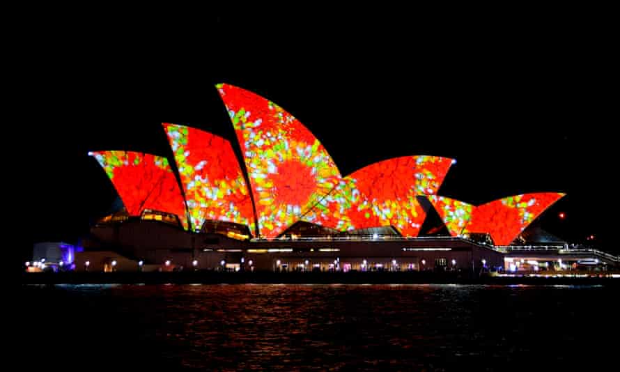 The Opera House lit up in bright red and green lights for Vivid 2022