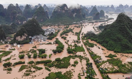 Submerged streets and buildings after heavy rain caused flooding in Yangshuo