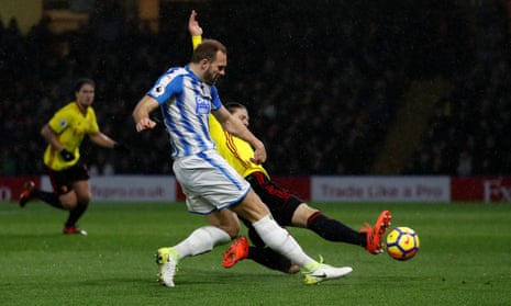 Laurent Depoitre fires in Huddersfield Town’s third from a tight angle.
