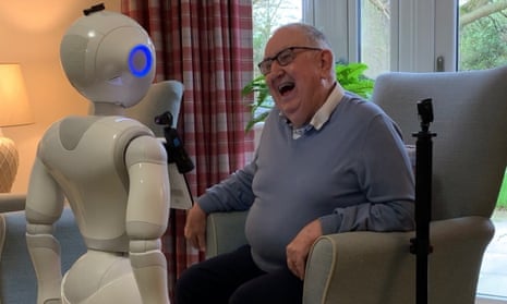 One of the robots with a care home resident