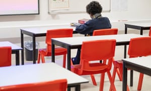 One of the few children working in a classroom at the school.