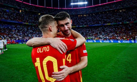 Aymeric Laporte celebrates with his Spain teammate Dani Olmo after the semi-final victory against France.