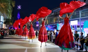 Artists perform on stilts at a New Year festival in Bangkok, Thailand.
