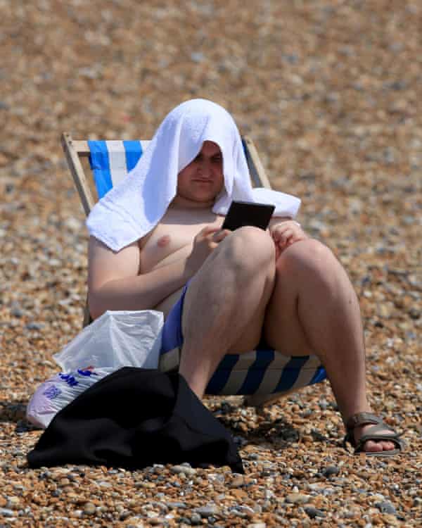 Sunbathing at Brighton beach.