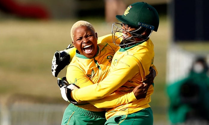 Nonkululeko Mlaba of South Africa (left) celebrates with Sinalo Jafta after she gets Sophia Dunkley of England out with the first ball of the match