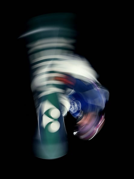 A slow shutter shot of Kira Kimura spinning on his snowboard.