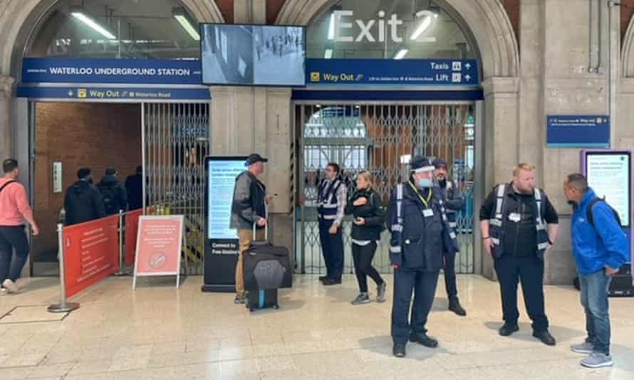 Commuters at Waterloo Station in London this morning, as members of the Rail, Maritime and Transport union take industrial action in a dispute over jobs and pensions.