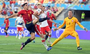 Gerard Moreno of Spain (left) tussles with Tymoteusz Puchacz of Poland.