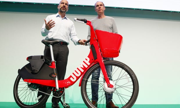 Dara Khosrowshahi (left), Uber CEO, presenting his firm’s Jump e-bikes in June in Berlin – the first European city where the service will be operate.