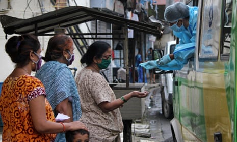 A mobile coronavirus screening van operates in Mumbai, as global cases pass 20m. India has the fastest growing infection numbers, recording more than 400,000 new case in the past week. 