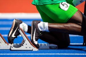 An athlete sporting a pair of ‘Team Nigeria’ socks as he waits on the starting blocks.