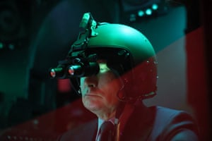 Vladimir Putin wearing a helmet with night-vision goggles