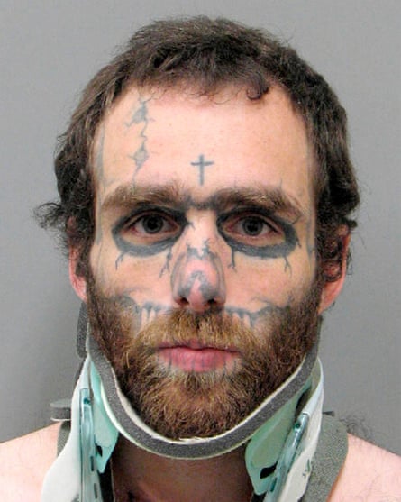 mugshot of man with tattoos on face