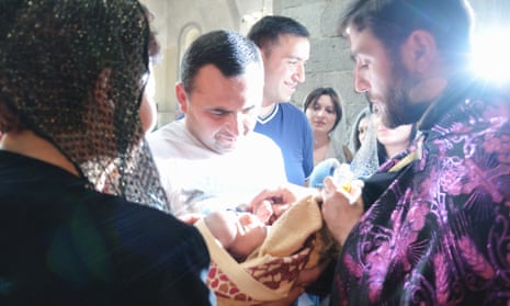 A baby is baptised in the Armenian Apostolic church in Goris, Armenia.