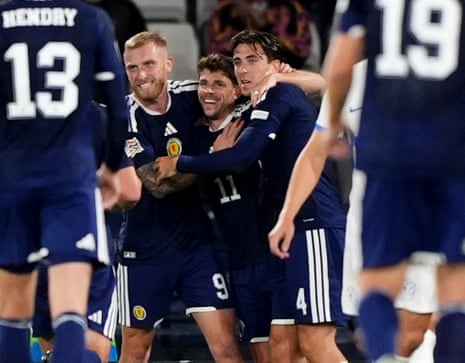 Scotland's Ryan Christie (centre) celebrates with his teammates after opening the scoring.